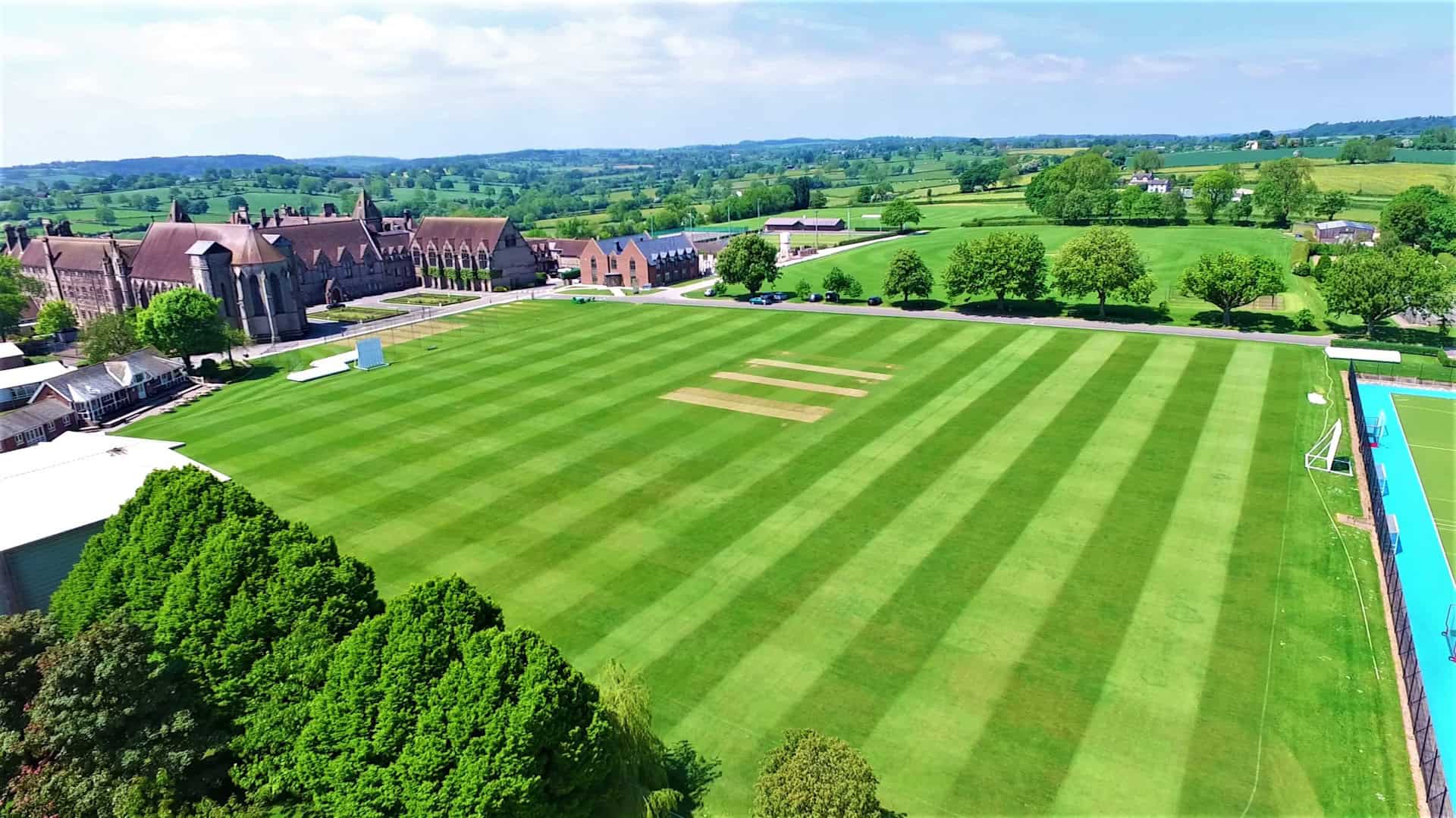 Denstone College cricket square surrounded by green playing fields