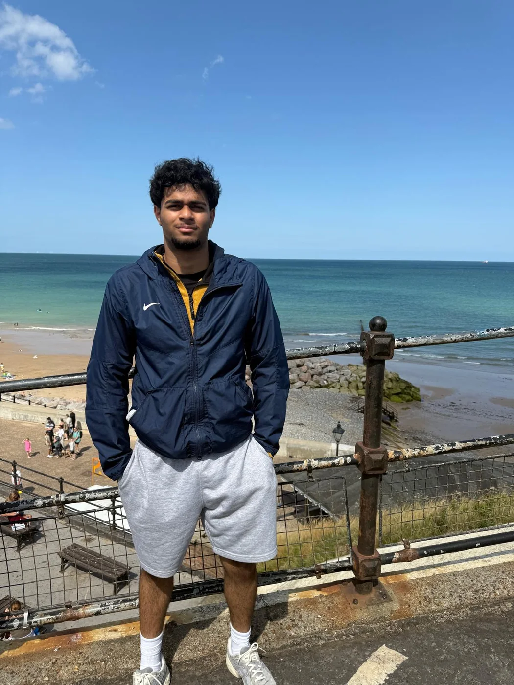 Daniel standing by the coast
