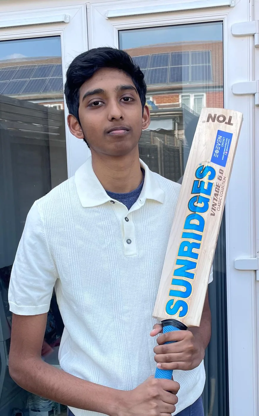 Jonathan holding a cricket bat