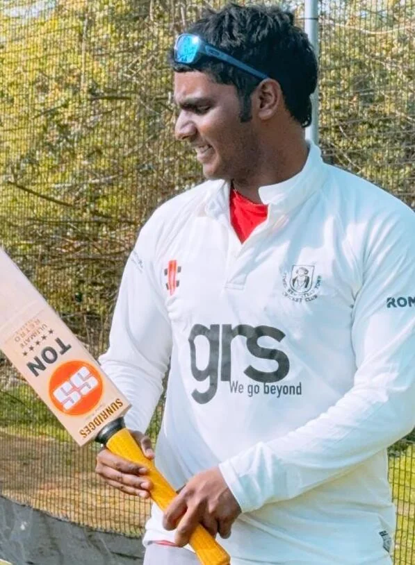 Julius holding a cricket bat
