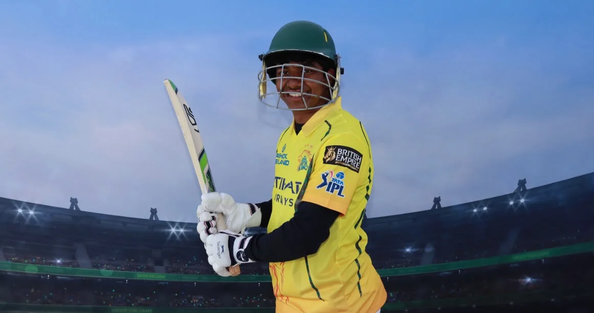 Sam wearing cricket batting equipment