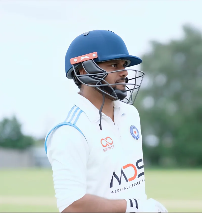 Pavan wearing cricket batting equipment