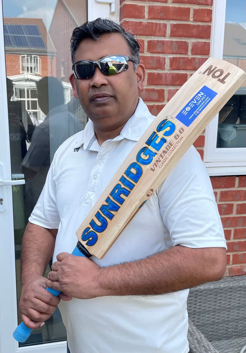 Spicer holding a cricket bat